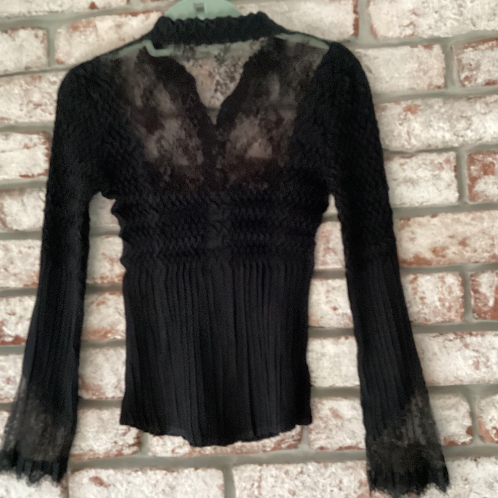 Woman’s sheer black blouse